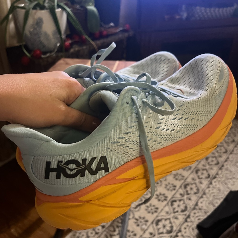 HOKAs blue and orange sneakers
